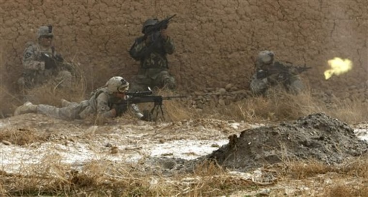 U.S. soldiers and one Afghan soldier exchange fire with insurgents during a patrol in the Badula Qulp area in southern Afghanistan on Sunday. In the fight, one soldier was wounded and one insurgent killed. 